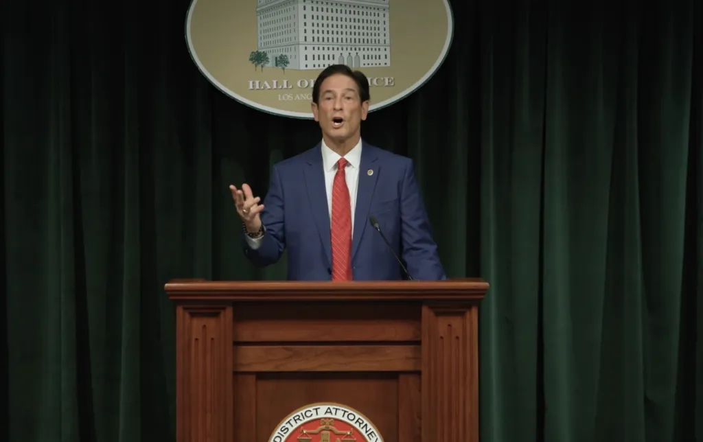 Los Angeles District Attorney Nathan Hochman speaking at a podium.