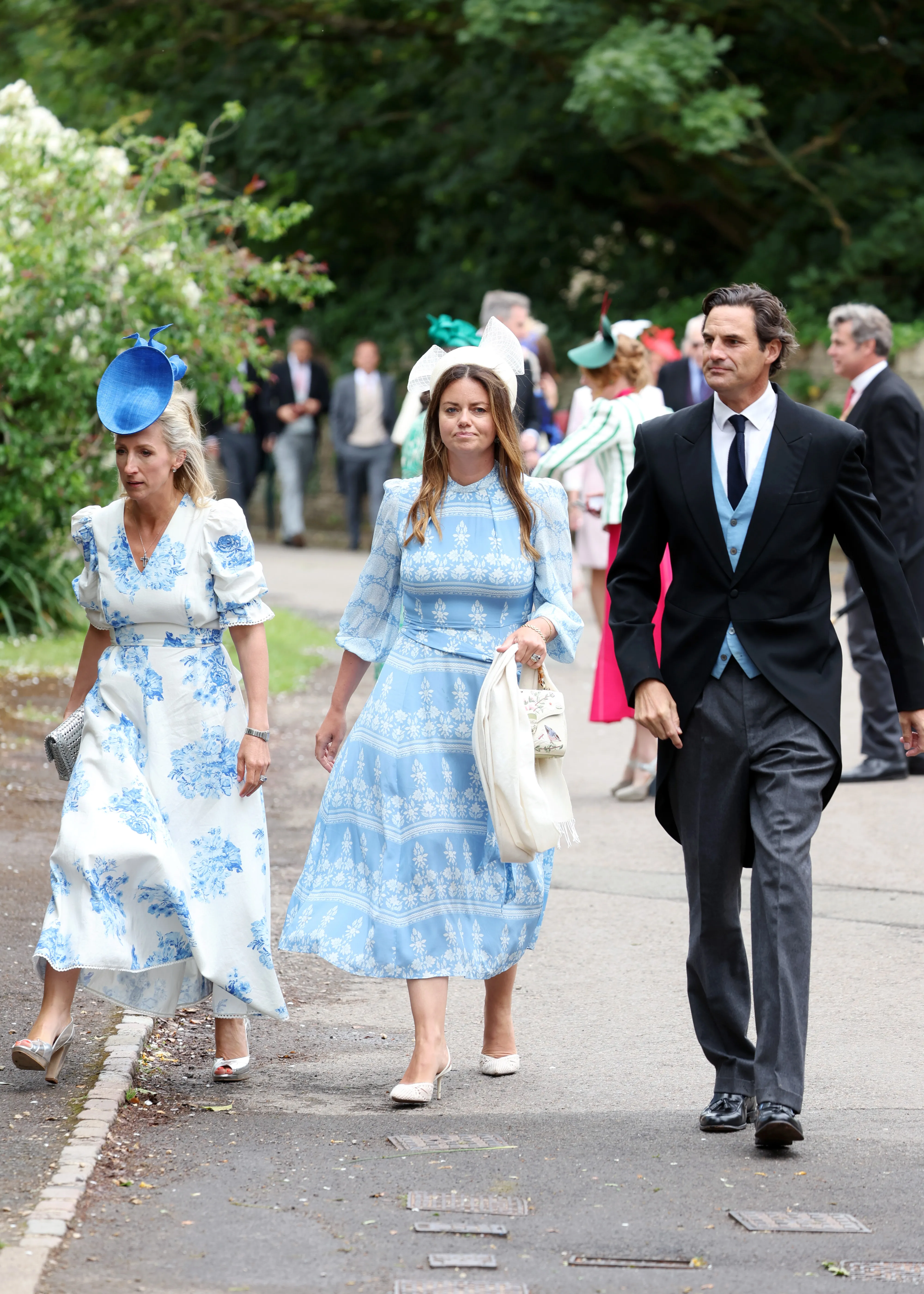 Lady Natasha Rufus Isaacs, Harriet Sperling, and Rupert Finch arriving at the royal wedding of Peter Phillips.