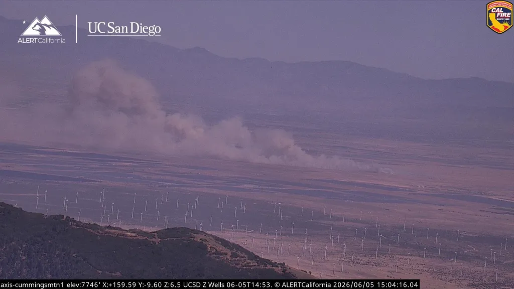 Smoke from the Macy Fire rising over a wind farm in Lancaster, CA.