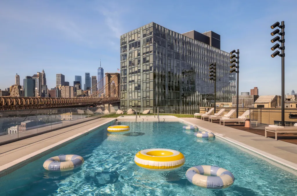 set within a park-like rooftop landscape that also features New York City’s highest private outdoor tennis court and a children’s waterpark, across 38,000 square feet of amenities completed in 2023.