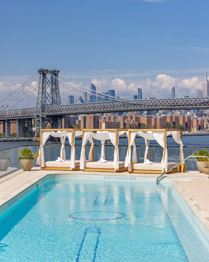 On the Williamsburg waterfront, Naftali Group’s Williamsburg Wharf complex at Kent Avenue takes the rooftop pool concept a step further by transforming it into an ice-skating rink each winter, with rentals starting at $3,170 for studios and $4,071 for one-bedrooms.