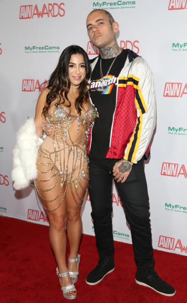 Lena The Plug and Adam22 posing at the AVN Awards red carpet.