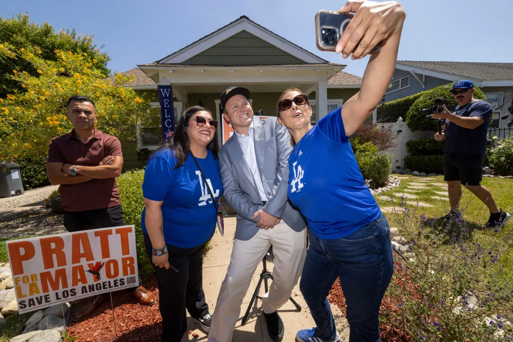 Los Angeles mayoral candidate Spencer Pratt posing for a selfie with supporters during a campaign event.