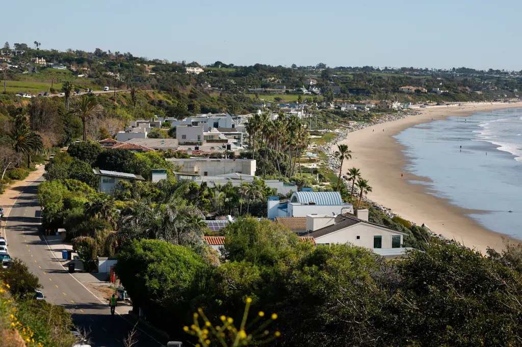 Luxury oceanfront homes line Broad Beach in Malibu, California.