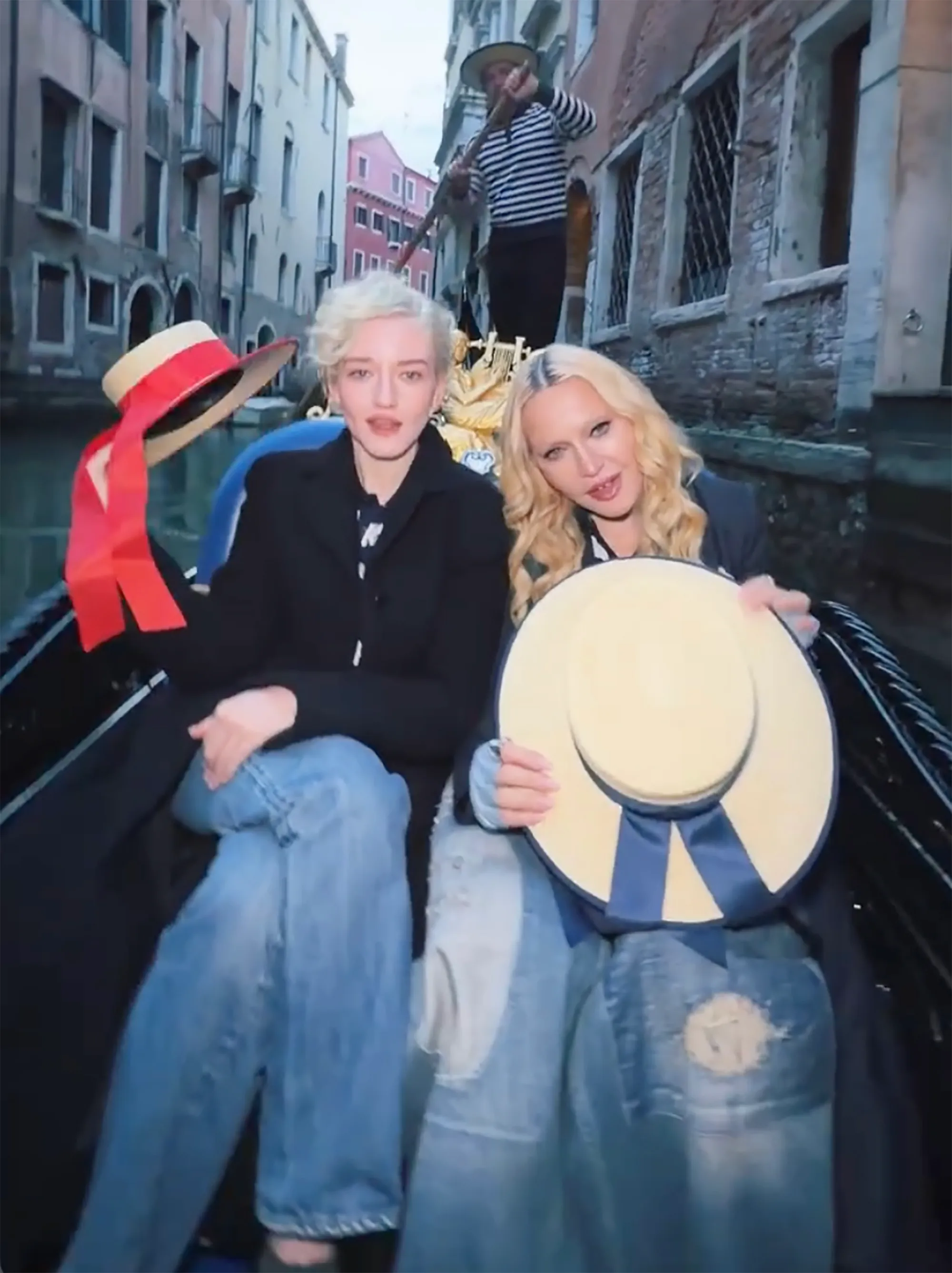 Madonna and Julia Garner twin on a gondola in Venice, singing 
