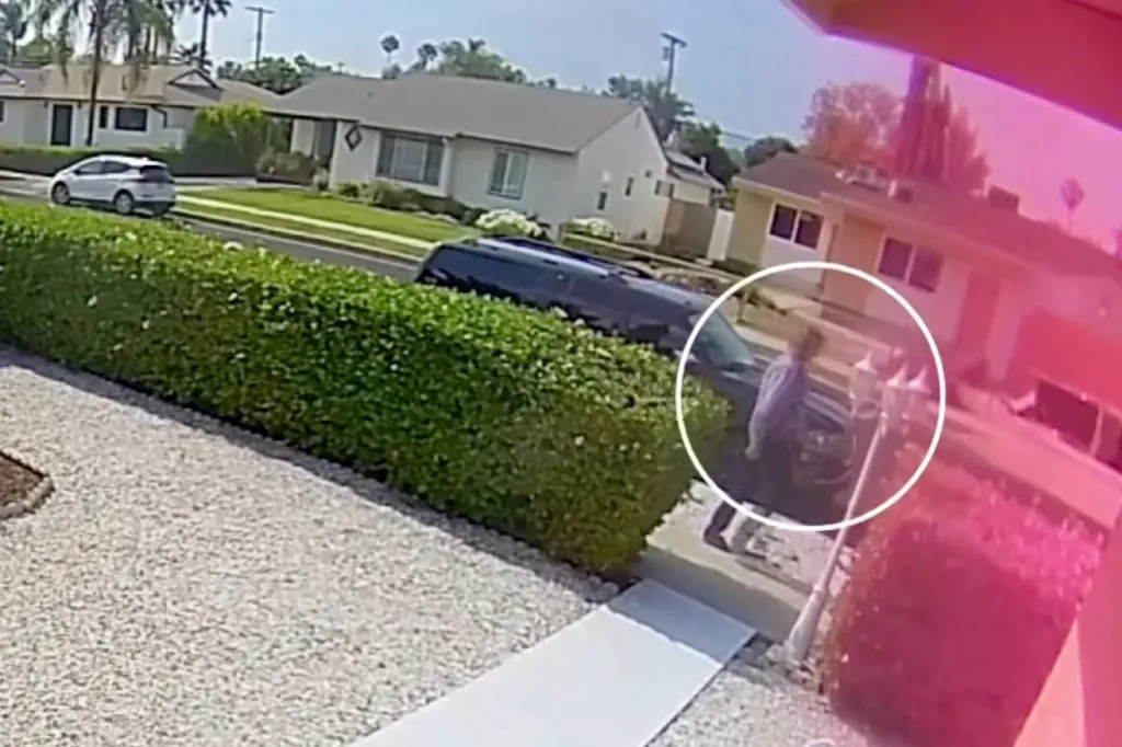 Surveillance footage shows a man, circled in white, calmly walking away from a vehicle on a residential street.