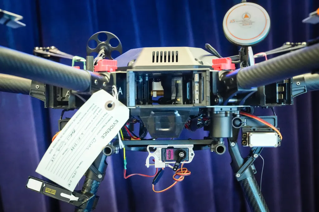 A mechanism used to drop a payload attached to a drone that was allegedly used to smuggle contraband into a prison is displayed during a news conference at the US Attorney's Office in Macon, Georgia, US, on Wednesday, June 24, 2026
