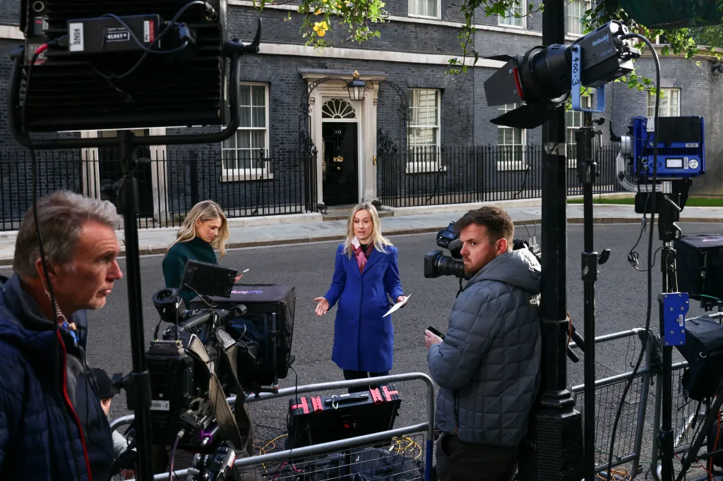 Media members outside No. 10 Downing Street before a British cabinet meeting.