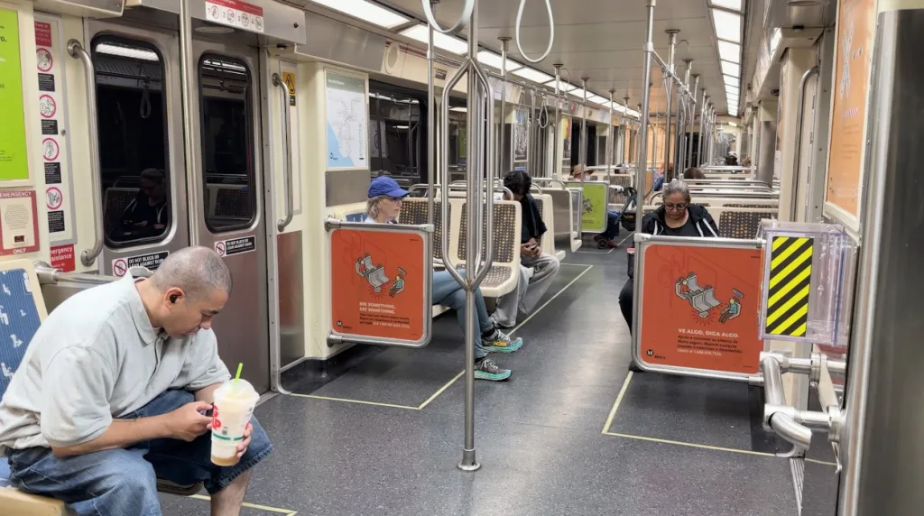 People riding a Metro train in Los Angeles.