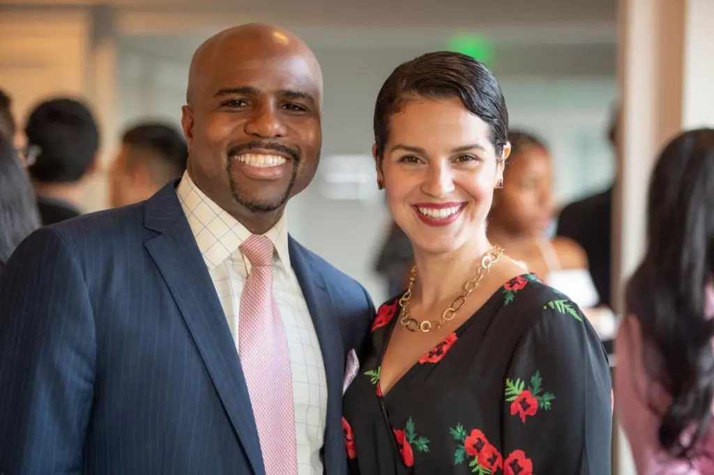 Chinweze Ahaghotu and a woman smiling at the 2018 Milken Institute Recognition Dinner.