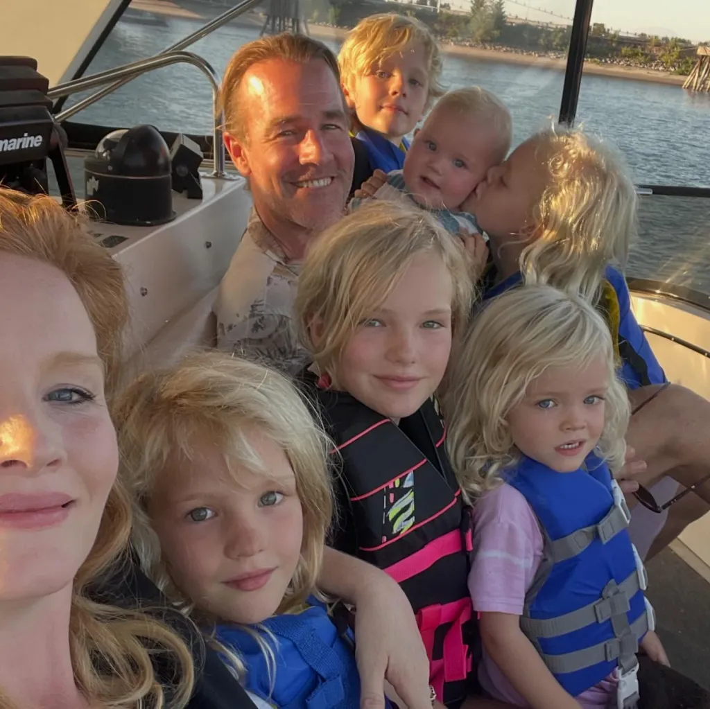 James and Kimberly Van Der Beek on a boat with their six children.