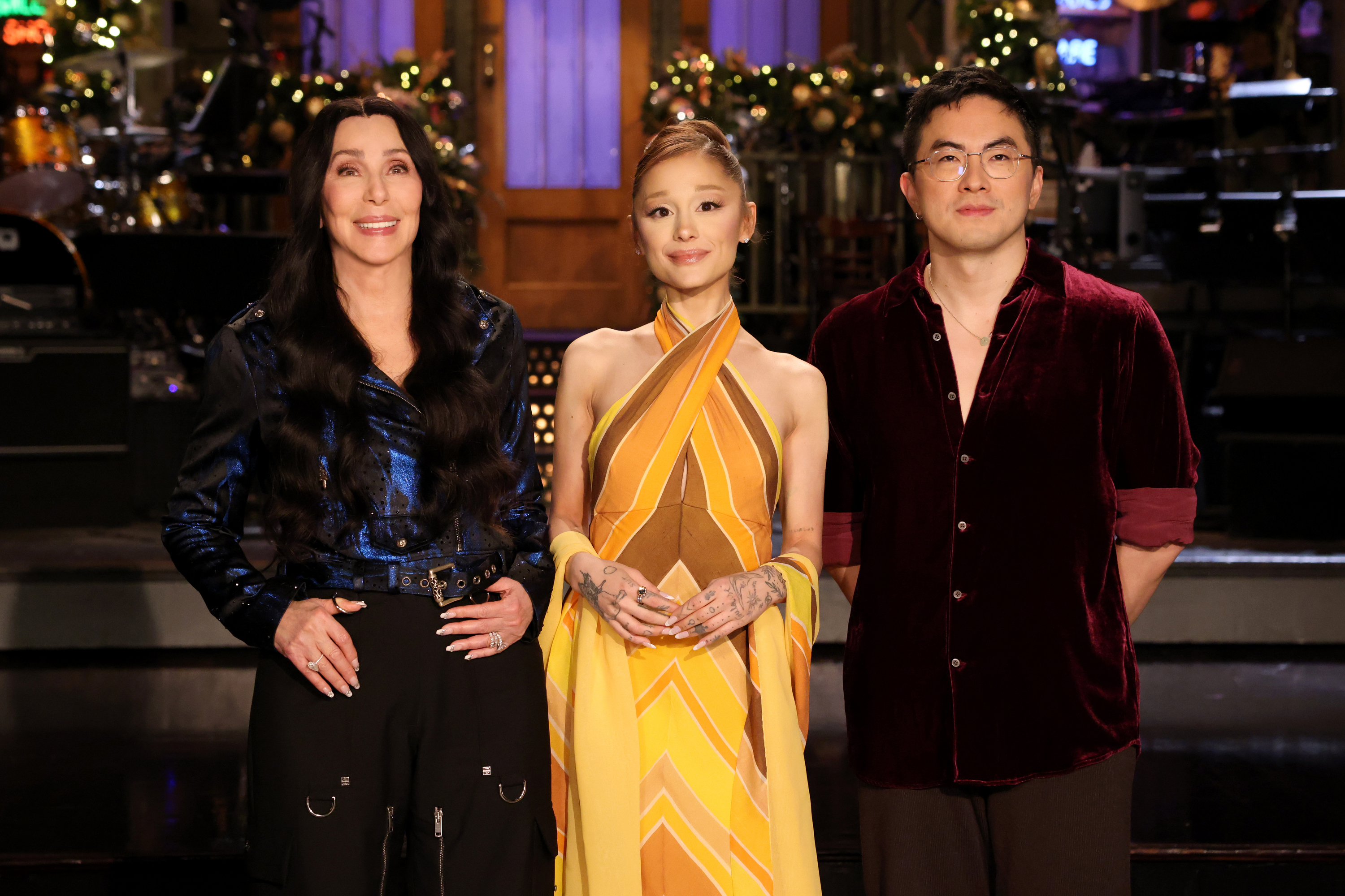 Musical guest Cher, host Ariana Grande, and Bowen Yang on Saturday Night Live.