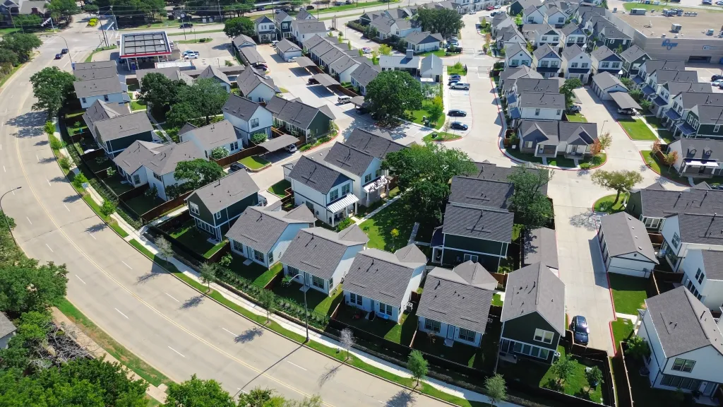 Aerial view of narrow lot single-family homes for rent along Northeast Green Oaks Boulevard in North Arlington, Texas.