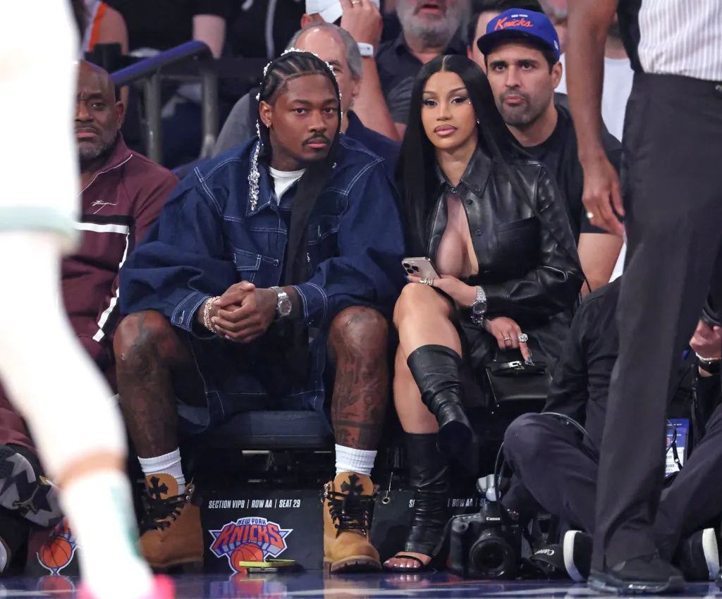 Rapper Cardi B and NFL player Stefon Diggs sitting courtside at a Celtics vs. Knicks playoff game.
