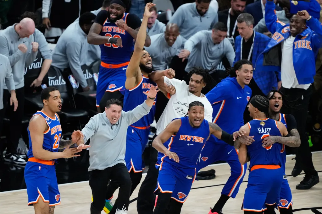 New York Knicks players and staff celebrate after winning Game 5 of the NBA Finals.