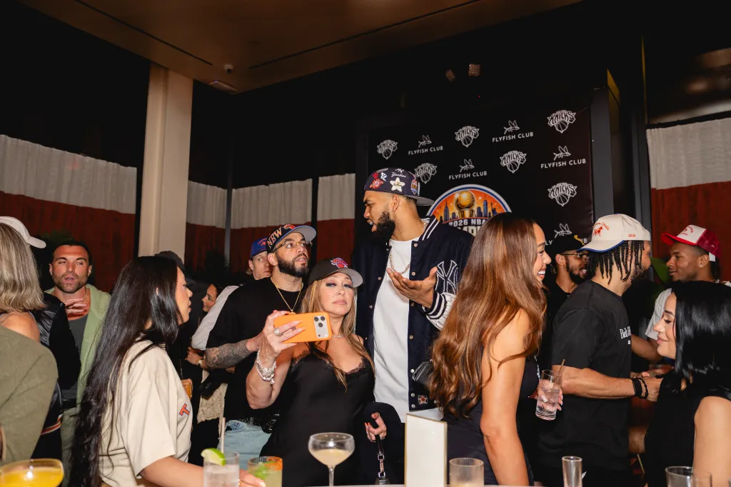 Basketball player Karl-Anthony Towns gestures while speaking to guests at the New York Knicks championship celebration at Flyfish Club.