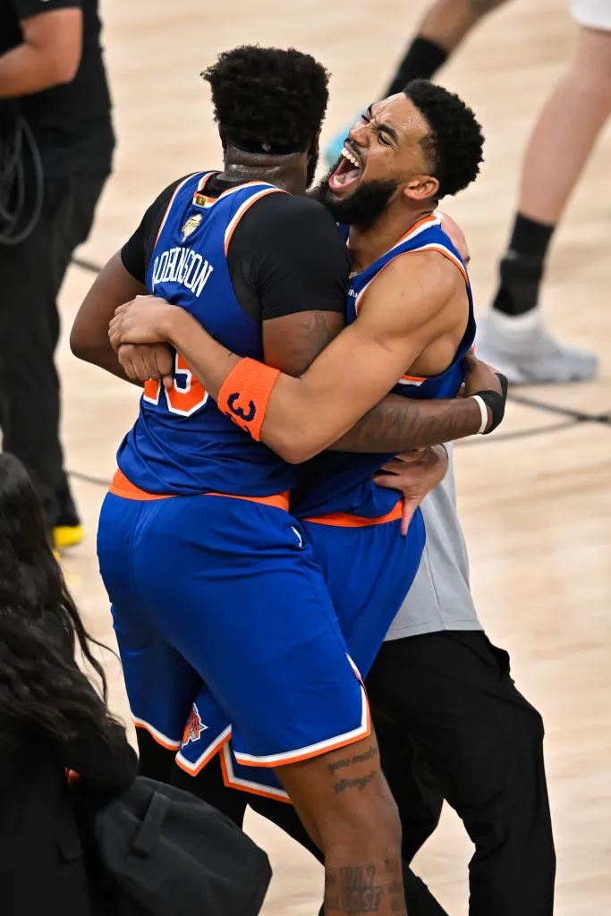 Karl-Anthony Towns, right, hugs Og Anunoby after defeating the San Antonio Spurs in Game 5 of the NBA Finals.