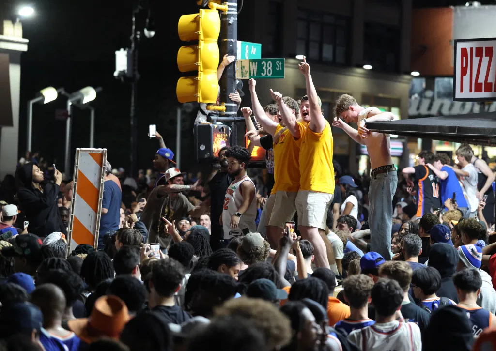 New York City erupted Wednesday night as Knicks fans celebrated in bars, bodegas and streets across the five boroughs after the team's stunning Game 4 comeback — putting them one win from the NBA title.