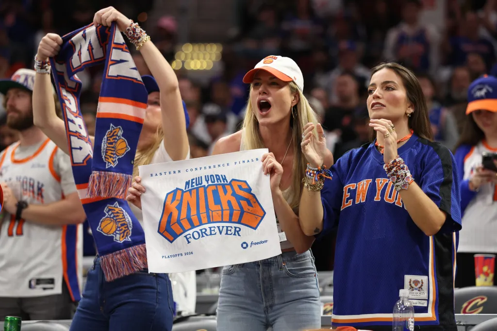New York Knicks fans cheering during an NBA playoff game.