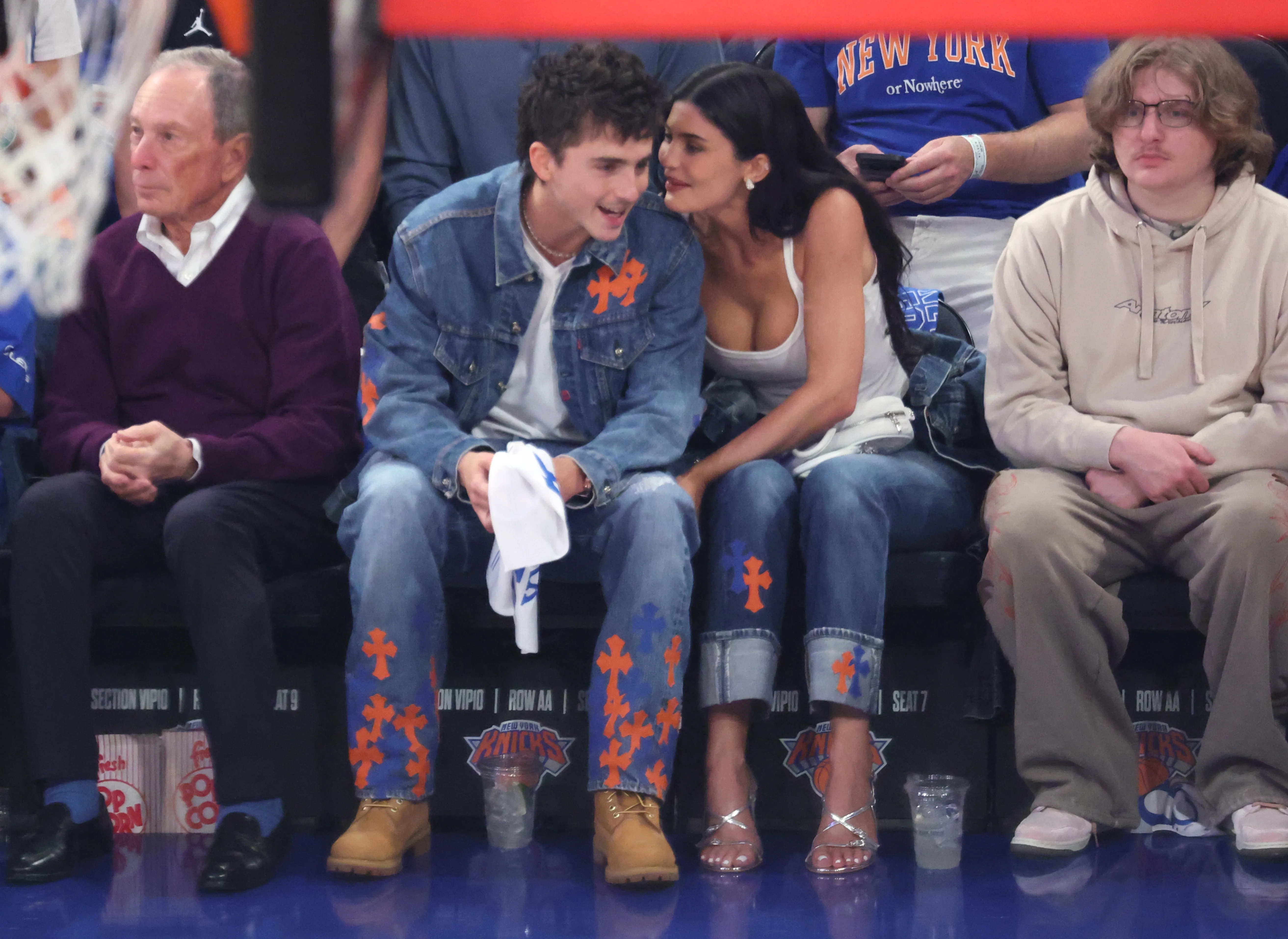 Kylie Jenner and Timothée Chalamet sitting courtside at an NBA game.