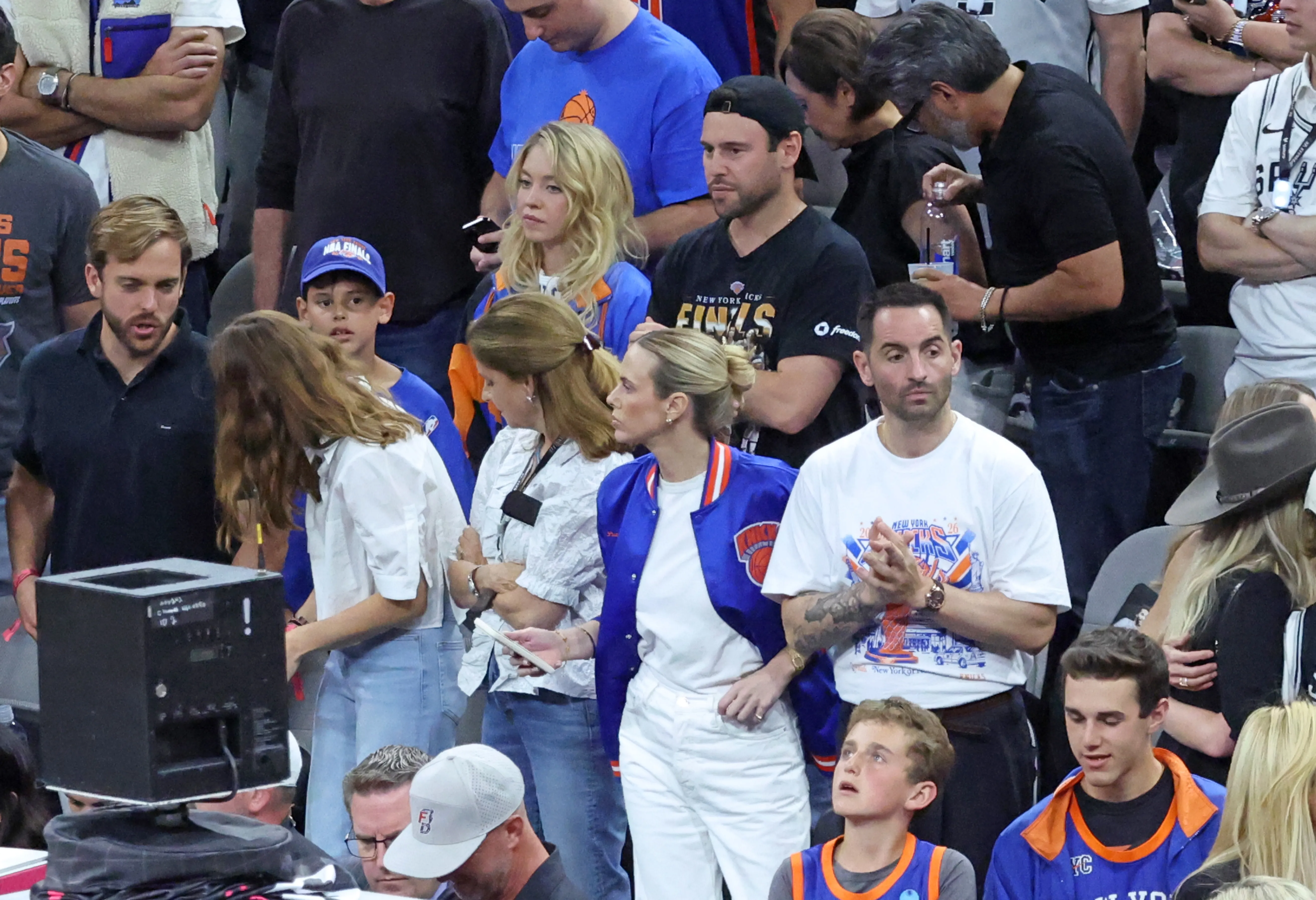 Actress Sydney Sweeney and music executive Scooter Braun in the crowd at the 2026 NBA Finals game between the New York Knicks and San Antonio Spurs.
