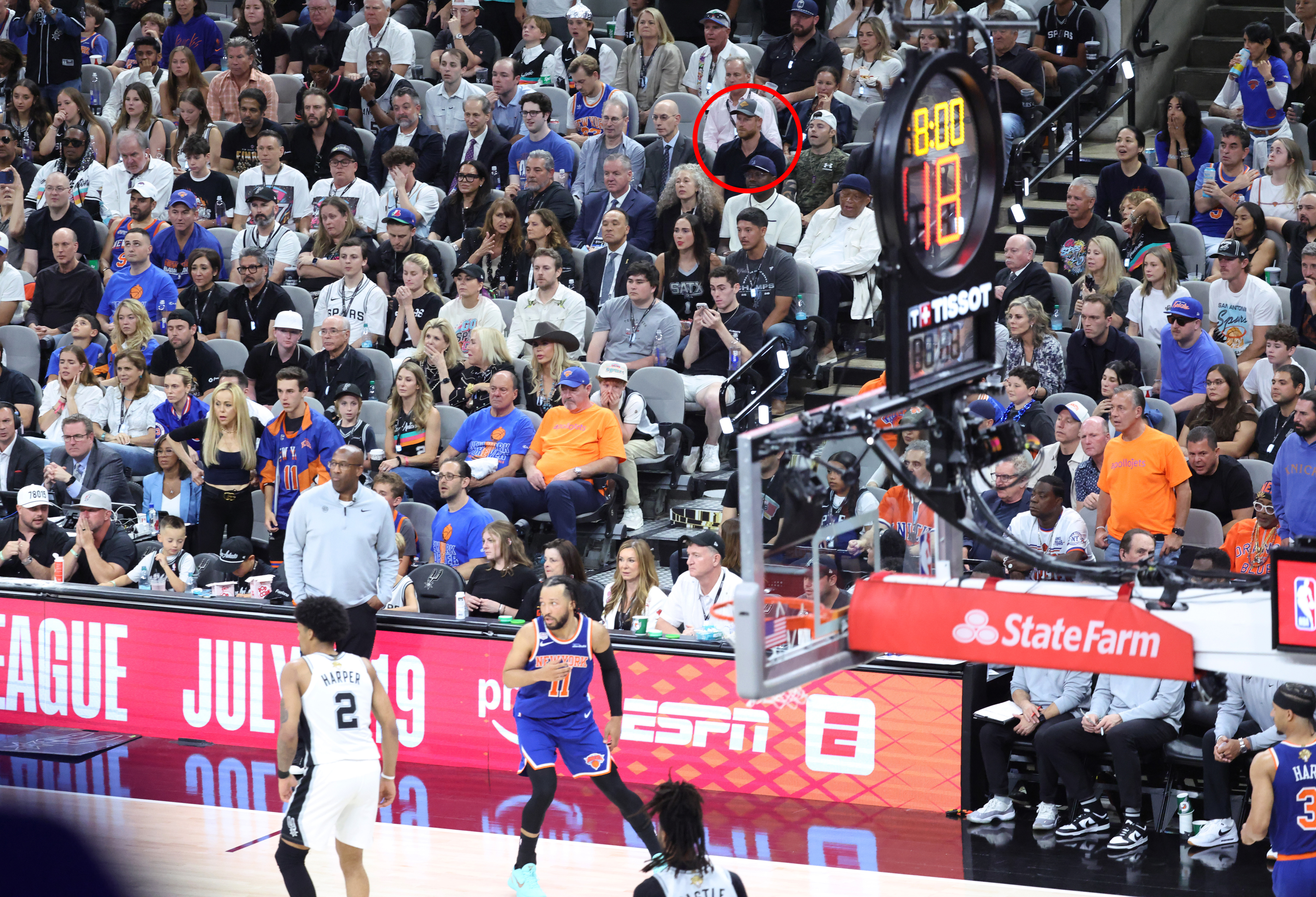Prince Harry sits with NBA Commissioner Adam Silver at the New York Knicks vs. San Antonio Spurs game.