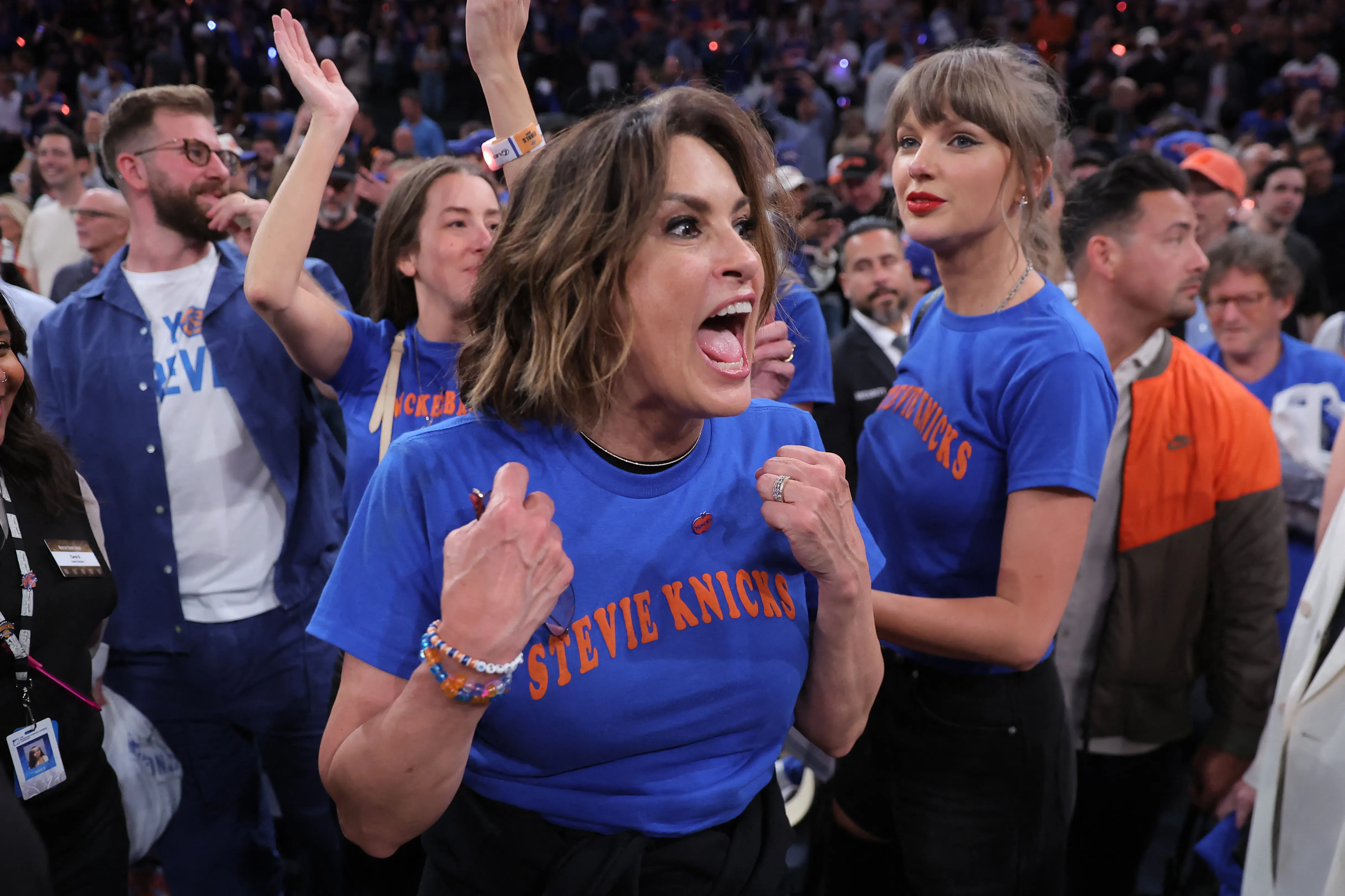 Mariska Hargitay cheering and Taylor Swift looking on at the NBA Finals.