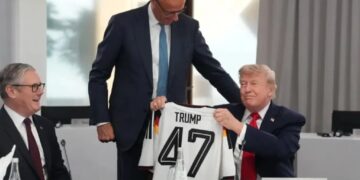 German Chancellor gives Trump a ‘TRUMP 47’ soccer jersey as belated birthday gift at G7 summit