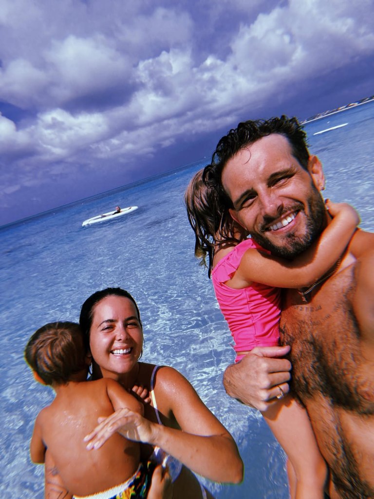 Nico Tortorella and Bethany C. Meyers with their children in the water.