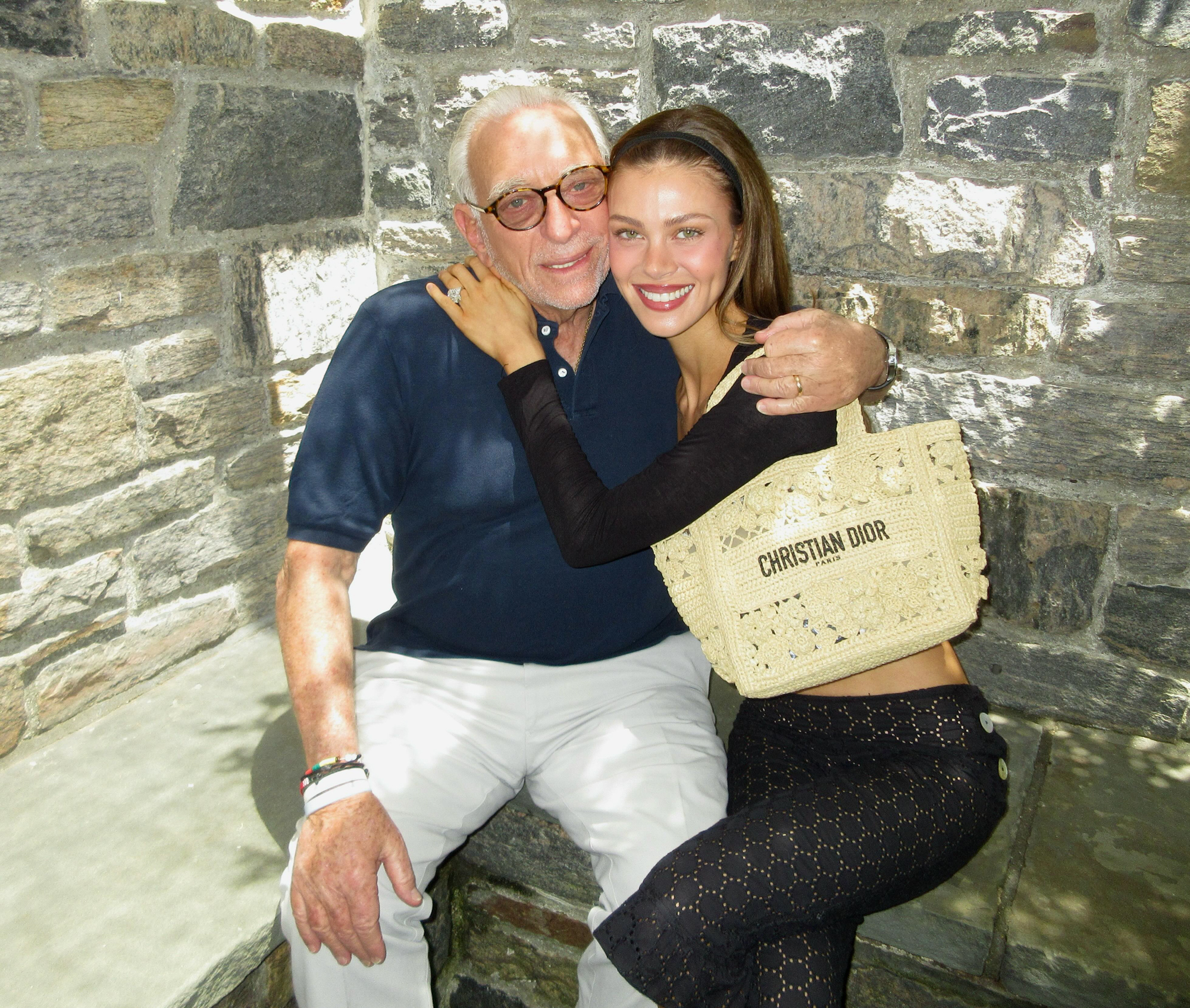 Nicola Peltz Beckham embracing her father.