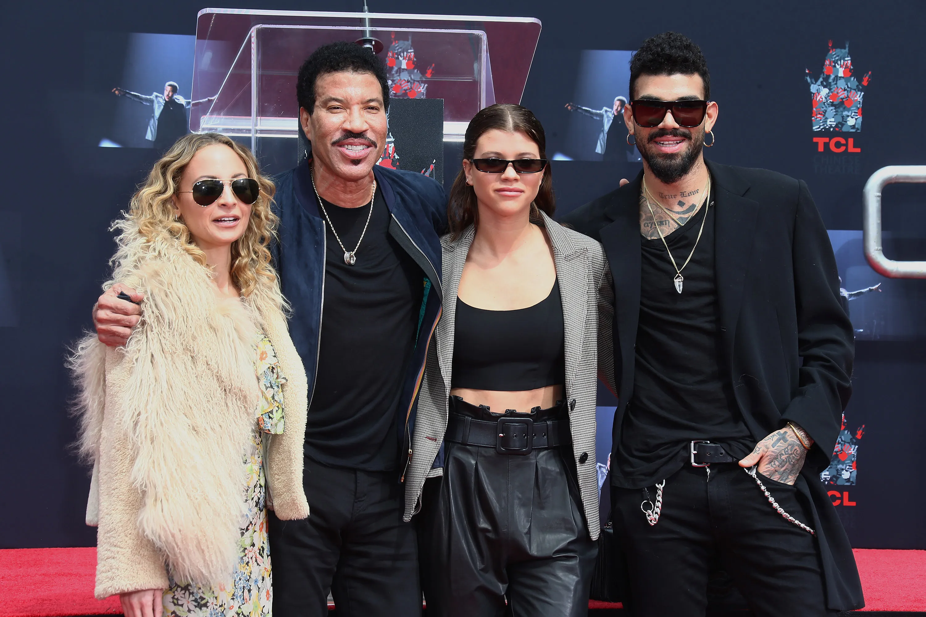 Nicole Richie, Lionel Richie, Sofia Richie, and Miles Richie pose together at Lionel Richie's Hand and Footprint Ceremony.