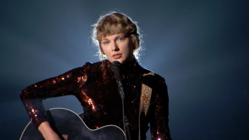 Taylor Swift performing onstage at the Academy of Country Music Awards.