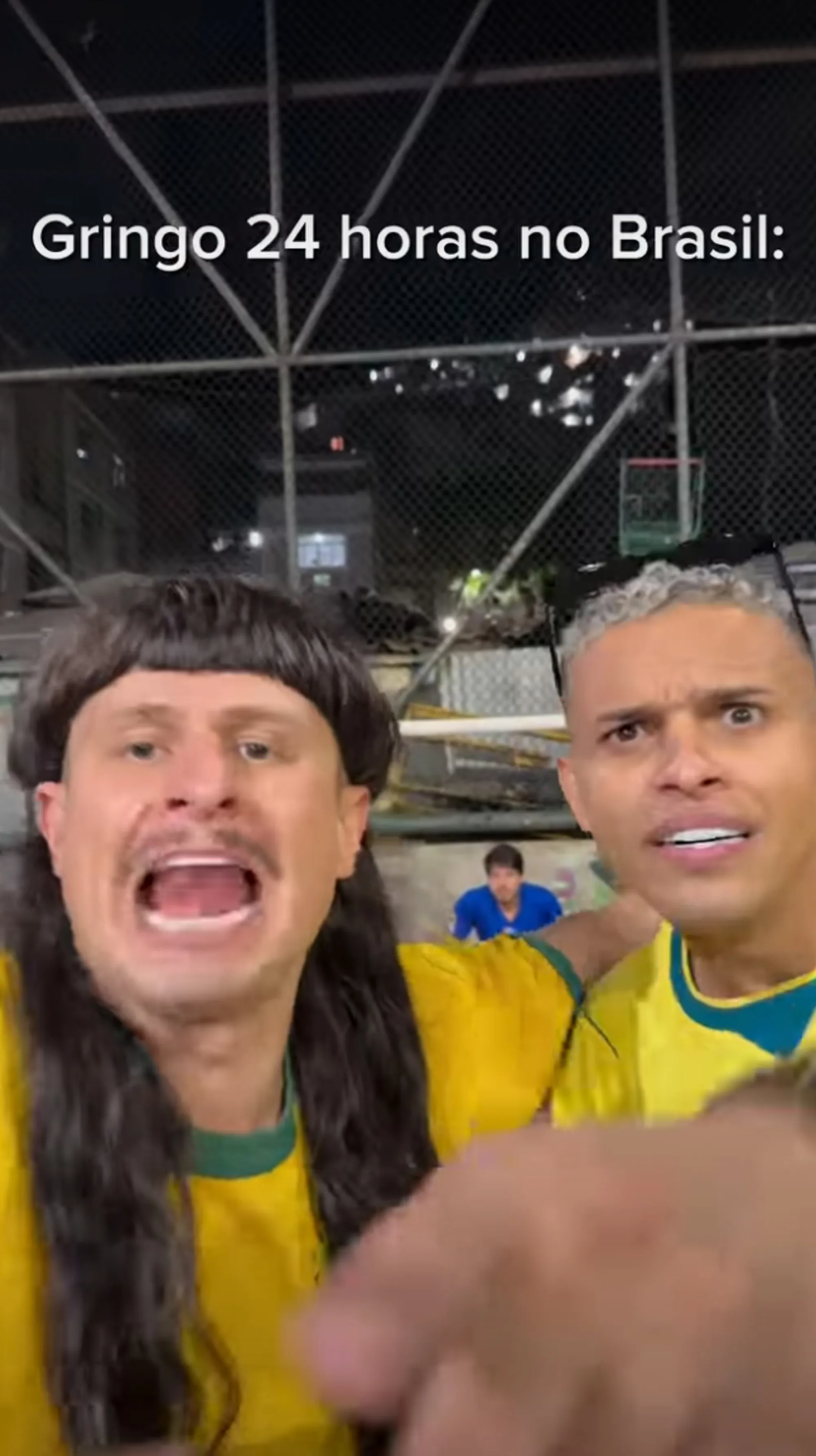 Two men reacting with wide eyes and open mouths, one in a mullet wig, with text that reads