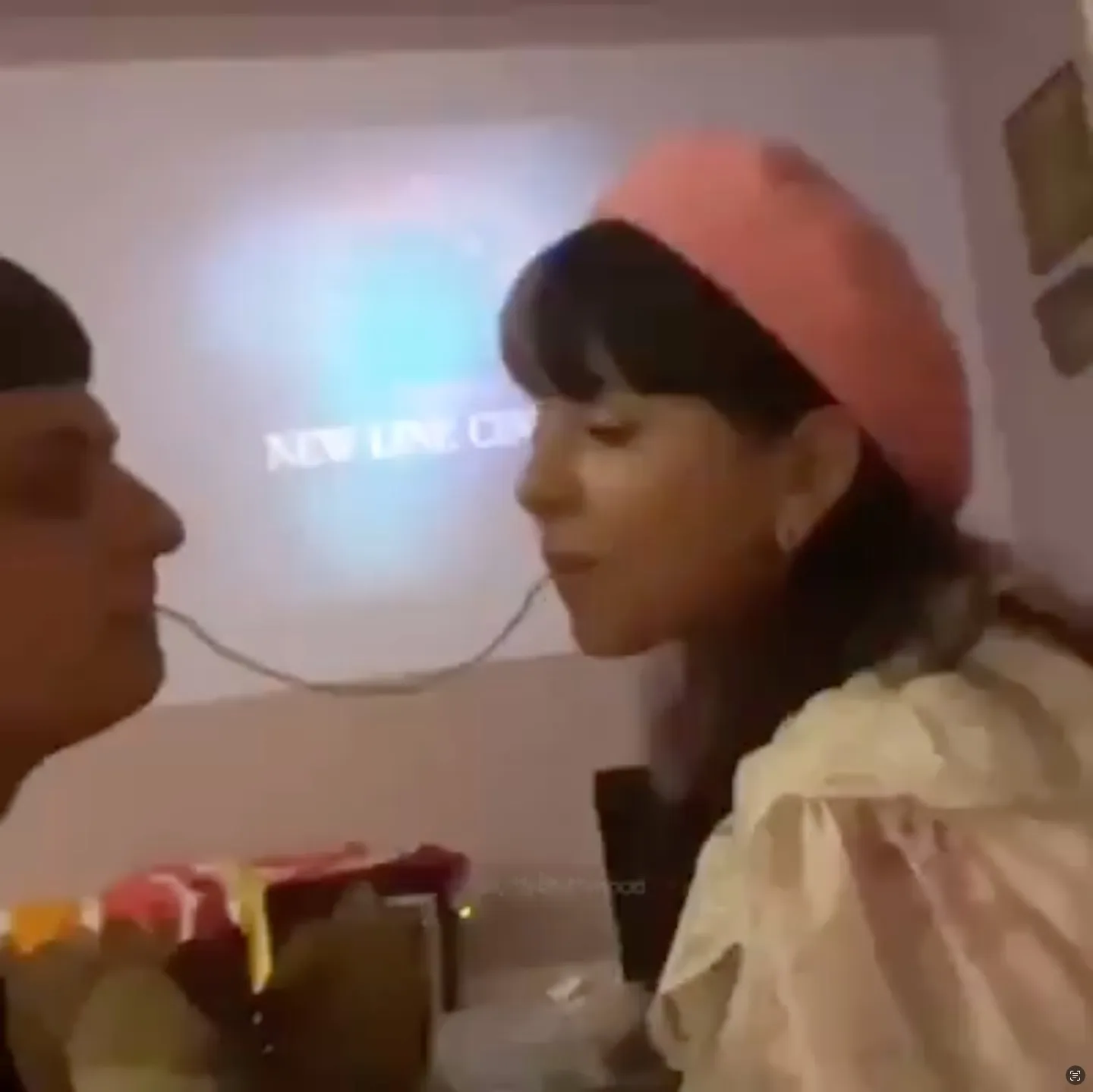 Oliver Tree and Melanie Martinez sharing a piece of spaghetti.