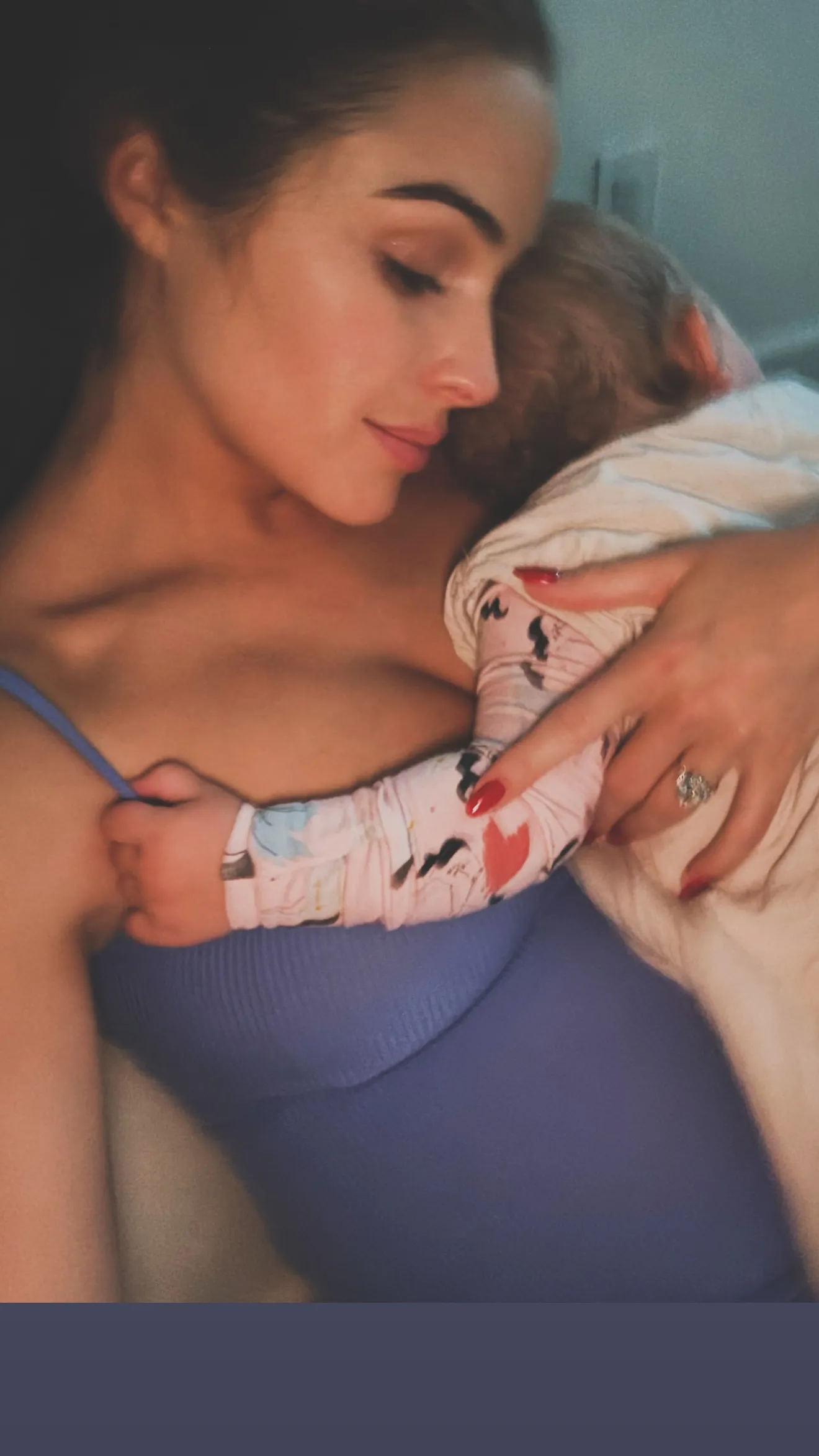 Olivia Culpo cuddles her daughter and shows off her baby bump.