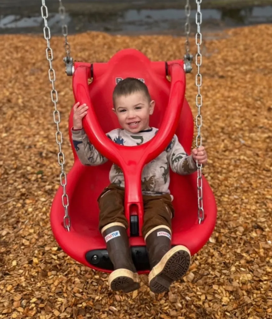 Dane Paulson in a red swing.