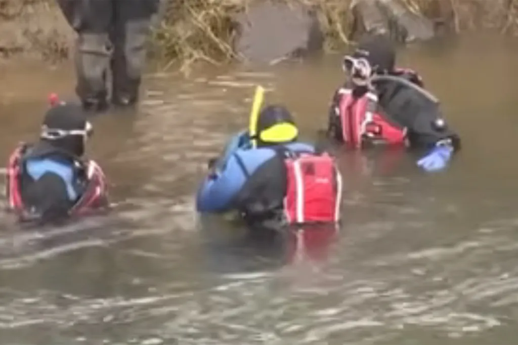 Search and rescue divers in a river.