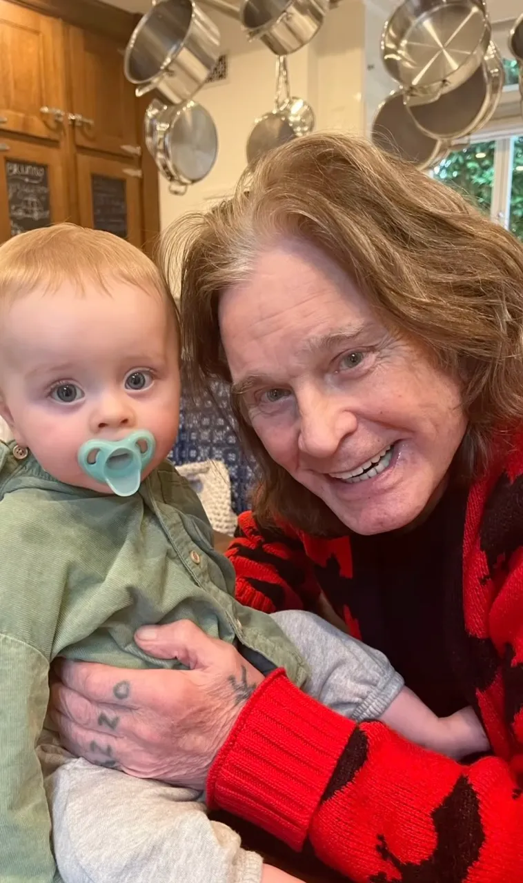 Ozzy Osbourne holds his grandson Sidney in a selfie.