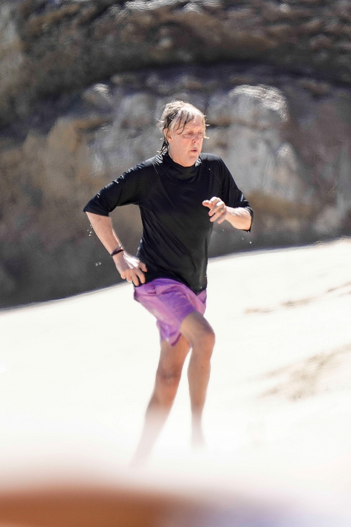 Paul McCartney runs on the beach in St. Barts after a swim.