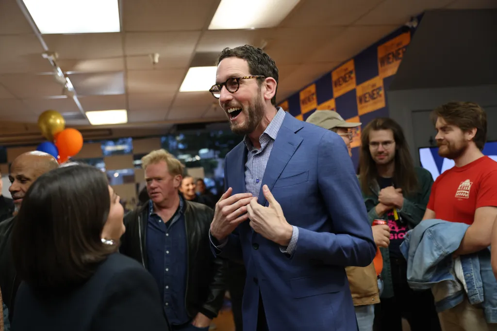 Senator Scott Wiener speaking animatedly at his election night party.