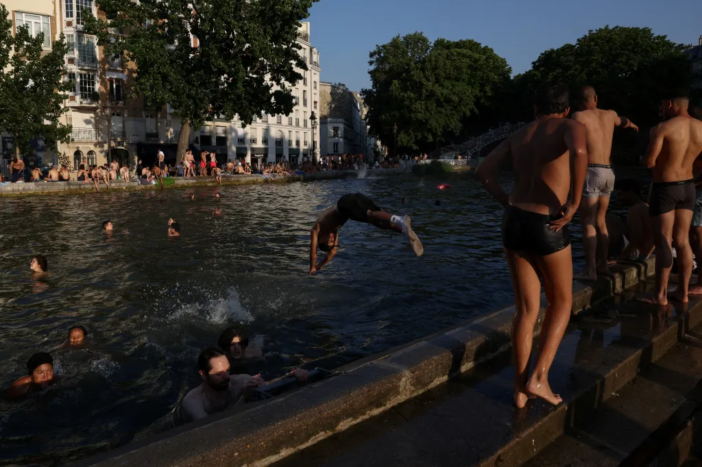People swim in the Canal Saint-Martin in Paris.