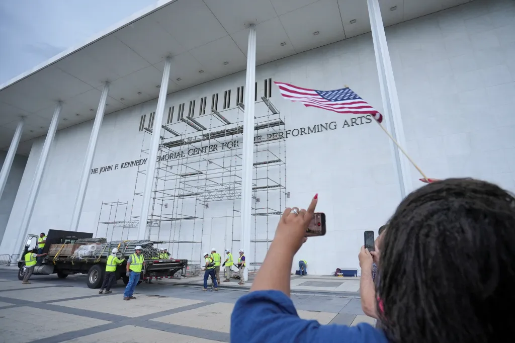 Protesters gather near the Kennedy Center ahead of the removal of Trump's name on June 12, 2026.