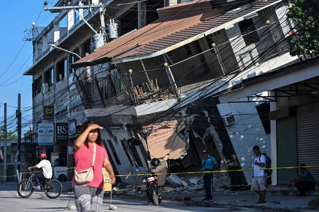 A person rides a bicycle past a collapsed building a day after the magnitude 7.8 earthquake, in Calumpang, General Santos, southern Philippines, June 9, 2026.