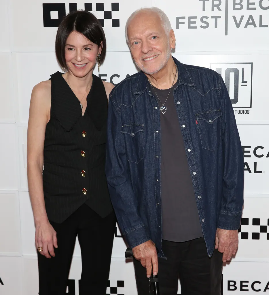 Peter Frampton and a woman smile at the 