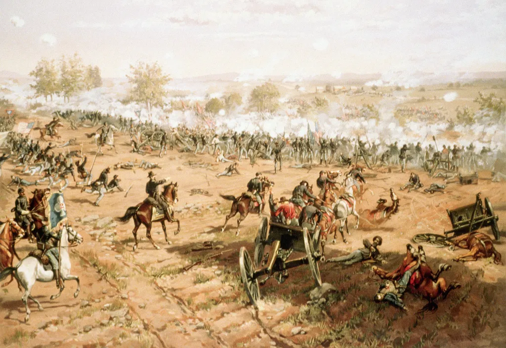 Illustration of the Battle of Gettysburg, with soldiers fighting on horseback and on foot, surrounded by smoke and fallen men and horses.