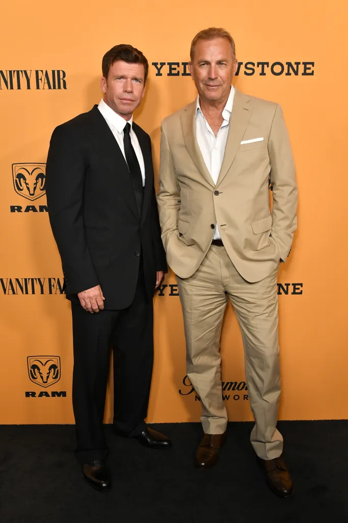 Taylor Sheridan and Kevin Costner standing together at the Yellowstone TV show premiere.