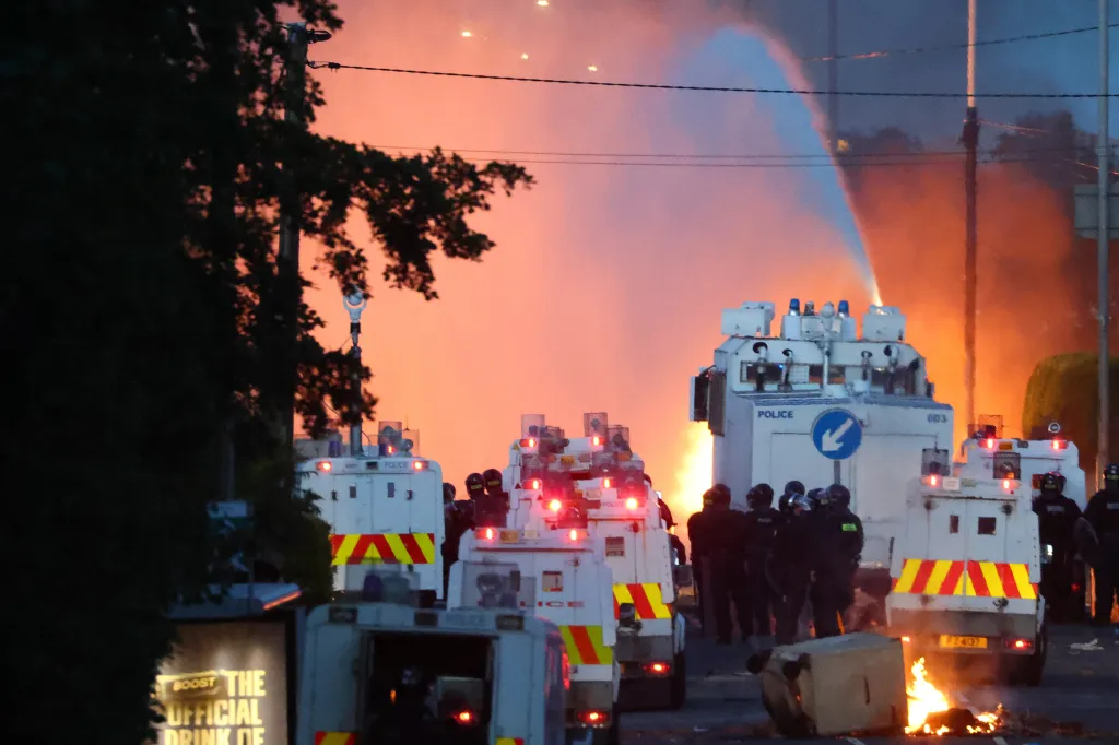 Police use a water cannon to disperse protesters in Newtownabbey, Northern Ireland.