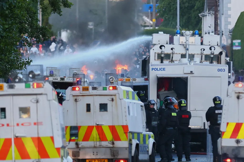 Police use water cannons to disperse protesters near Newtownabbey, Northern Ireland.