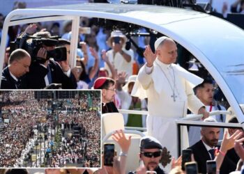 1 million people flood Madrid streets to see the pope’s flower-carpeted procession