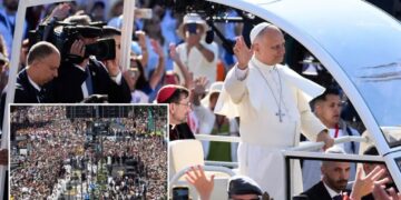 1 million people flood Madrid streets to see the pope’s flower-carpeted procession
